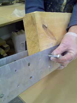 Placing a Coach Screw into a BM6 Joist End Repair Plates